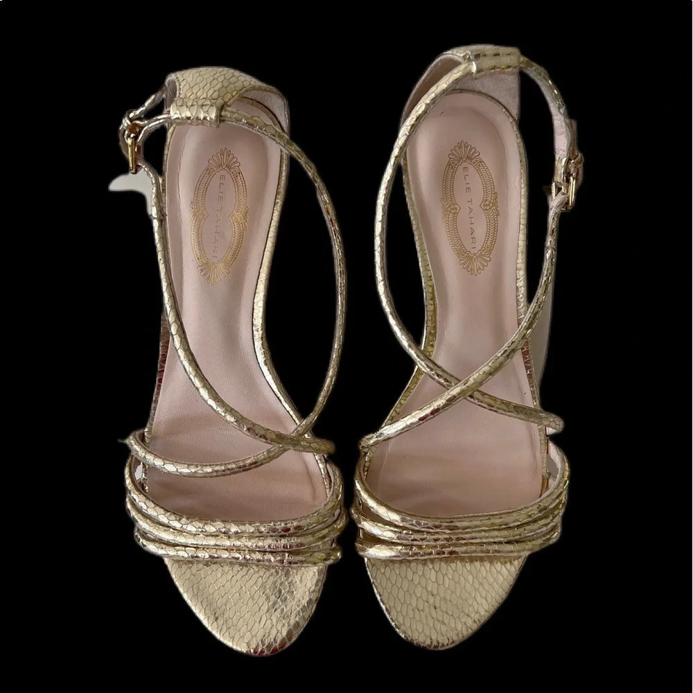 Elise Tahari gold wedges. Buckle strap. 1. 5 inch wedge.Gold color size 36 or 6